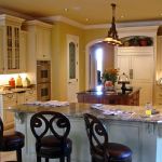 Kitchen features Stanisci E-Series Hood, Conestoga CRP-10797 Applied Mold Door.
Finish: Crystal White Stain with Coffee Glaze